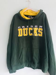 Oregon ducks Green/yellow sweatshirt 90s Size XL perfect condition embroided logo Brand: Stadium Athletics Green Sports Hoodie With Crew Neck, Green Crew Neck Sports Hoodie, Oversized Green Sports Hoodie, Oversized Green Hoodie For Sports, Green Oversized Hoodie For Sports, Collegiate Green Sweatshirt For Football Season, Green Collegiate Sweatshirt For Sports Season, Green Collegiate Sweatshirt For Sports, Green Fan Apparel Hoodie For Streetwear