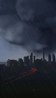 an image of a city at night with rain coming down on the street and buildings in the background