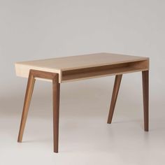 a small wooden table with two legs and a drawer on the top, against a white background