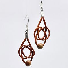 This is our 3 loop style Celtic knot with a more natural wooden bead in brown leather. Celtic Knot Earrings, Celtic Knot Designs, Celtic Earrings, Knot Earrings, Celtic Knot, Leather Cord, Wooden Beads, Wood Beads, Fun Learning