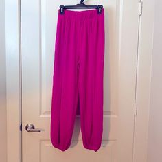 Zenana Women's Magenta Pink Split-Side Pants With Elastic Waist & Ankle Waist:S-13",M-14",L-15",Xl-16" Length:S-39",M-40",L-26.5",Xl-41" 57% Polyester 38% Rayon 5% Spandex Stretch Pink Bottoms With Pull-on Style, Ankle-length Harem Pants For Loungewear, Spring Harem Pants For Loungewear, Spring Harem Pants For Loungewear, Ankle-length, Spring Ankle-length Harem Pants For Loungewear, Stretch Pull-on Harem Pants For Loungewear, Pink Ankle-length Relaxed Fit Harem Pants, Pink Ankle-length Harem Pants With Relaxed Fit, Fitted Ankle-length Bottoms With Elastic Waistband