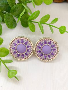 "Purple circle earrings. Beadwork earrings with rhinestone. Beaded earrings with cabochon. Earrings are handmade from Japanese beads Toho, using felt, a strong synthetic thread, nickel-free clasp, rhinestone chain, and leatherette. Measurements: Diameter earrings ≈ 1,25\" You can see more colors here: https://www.etsy.com/listing/1291802643/beadwork-stud-native-style-earrings It will be a great gift, I send all jewelry in gift wrapping. Please note: do not wear beaded jewelry during active sports, swimming, and sunbathing. Do not put perfume and other cosmetics on bead jewelry. Real colors may slightly differ from one on the monitor to another, as it depends on specific monitor settings. You can also order earrings in colors you like! Thank You for visiting my store! Please, don't hesitate Purple Circle, Embroidery Earrings, Native American Beadwork Patterns, Beautiful Beaded Earring, Beadwork Earrings, Native Beading Patterns, Beaded Earrings Native, Circle Jewelry, Art Perle