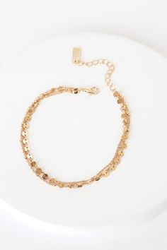 Lulus Exclusive! You'll love the delicate charm of the Lulus Dashing Gold Circle Charm Anklet! Three layers of dainty gold chain, accented with gold beads and circle charms, shape this simply stunning ankle bracelet. Lobster clasp closure. Ankle bracelet measures 8" long with a 2. 25" extender chain. Man Made Materials. Imported. Lulus | Dashing Gold Circle Charm Anklet. Gold Charm Bracelet With Gold Beads, Gold Double Chain Bracelet For Party, Gold Party Bracelet Anklets, Delicate Gold Chain Bracelet For Party, Dainty Gold Anklet With Delicate Chain, Adjustable Gold Anklet With Delicate Chain, Delicate Gold Anklet With Adjustable Chain, Delicate Gold Charm Bracelet With Delicate Chain, Dainty Gold Chain