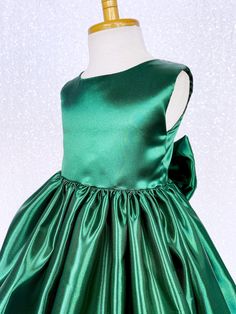 A classic and simple but beautiful full satin dress that's perfect for any formal occasion: weddings, graduations, birthdays, or holidays! Handcrafted with the upmost of care and attention to detail, we make sure that each dress is perfectly one of a kind for your little girl. Comfortable satin material covers the dress from shoulder to hem. The sleeveless top has a zipper on the back for closure. Comes with a detachable matching bow with tails. The skirt has a layer of lining underneath with at Elegant Sleeveless Green Princess Dress, Sleeveless Ball Gown For Christmas Wedding, Fitted Satin Princess Dress Sleeveless, Fitted Sleeveless Satin Princess Dress, Elegant Christmas Ball Gown, Elegant Solid Color Princess Dress For Dress-up, Sleeveless Satin Princess Dress For Pageant, Fitted Sleeveless Christmas Ball Gown, Sleeveless Satin Princess Wedding Dress