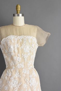 "Outstanding vintage 1950s cocktail party dress by Irene Sargent. This vintage dress features a wonderful Chantilly lace over lace with a gorgeous tier pencil skirt. The bodice is well fitted with bust darts, nipped waist, and a back metal zipper for closure. ✂------ M E A S U R E M E N T S ------- Best Fit: Small Bust: 32.5/33\" Waist: 24.5/25\" Hips: 37.5\" Shoulders: undefined Sleeves: 3.5\" Total Length: 44.5\" Tag/Label: Irene Sargent Material: Chantilly lace, silk Condition: Excellent vint Cream Party Dress With Delicate Lace, 1950s Fitted Dress With Lace Trim, Vintage Party Dress With Lace Patchwork, Vintage Lace Patchwork Party Dress, Retro Lace Vintage Dress For Party, Vintage Lace Dress For Party In Retro Style, 1950s Cream Wedding Dress, Vintage Lace Party Dress, Elegant Lace Dress With Lace Bodice For Vintage Events