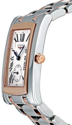 L5.655.5.71.7 | L56555717 LONGINES DOLCEVITA TWO TONE ROSE GOLD & STEEL MEN'S LUXURY WATCH - With Manufacturer Serial Numbers - Swiss Made - Silver Dial - Blue Roman Numeral Hour Markers - Minute Markers Around Outer Rim - Blue Sword Shaped Hands - Polished Solid 18k Rose Gold Bezel - Date Feature - Small Seconds Sub-Dial at 6 O'Clock - End of Life Indicator (EOL) - Battery Operated Quartz Movement - Longines Caliber L176 - Jewels: 15 - 3 Year Warranty - Guaranteed Authentic - Certificate of Authenticity - Manufacturer Box & Manual - Polished Stainless Steel Case - Polished Stainless Steel with Solid 18k Rose Gold Bracelet - Scratch Resistant Sapphire Crystal - 30 Meters / 100 Feet Water-Resistant - 32.10mm x 26.30mm = 1 1/4" x 1" Case, 7" Adjustable Bracelet - Display Type: Anaolg - Case Bracelet Display, Display Type, Rose Gold Case, Free Bracelet, Roman Numeral, Rose Gold Bracelet, Luxury Watches For Men, Roman Numerals, Swiss Made