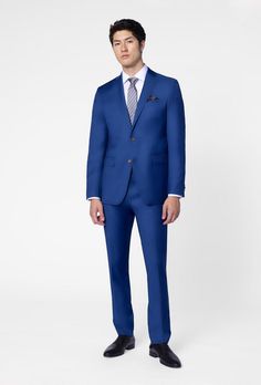 Classic, versatile and reliable - the Hemsworth is your tried-and-true blue suit. This solid-colored number in pure premium wool stands up to whatever the daily hustle throws at you. Custom Fit Suits With Welt Pockets For Wedding, Tailored Solid Suits For Wedding, Custom Fit Wedding Suits With Welt Pockets, Tailored Solid Color Wedding Suits, Business Set With Notch Lapel And Custom Fit, Tailored Solid Wedding Suits, Fitted Suits With Pressed Crease And Flat Front, Fitted Suit With Pressed Crease And Flat Front, Classic Custom Fit Suiting Fabric Sets