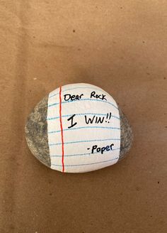 a rock with writing on it that says dear rock i won