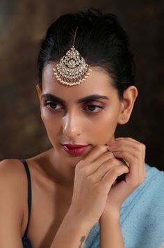 The elegance of timeless Kundan combined with high-grade shell pearls. This delicate maang tikka is set on silver alloy and plated with 22k gold. Perfect to wear to dinner, and the perfect gift for family members, friends, or bridesmaid. Style Tip - What's lovely about this piece is how even a small piece of jewellery can make such a huge impact on your entire look. You can dress this down by simply wearing this as a single piece and it will amp up the glam factor within seconds! Handcrafted in Elegant Meenakari Tikka For Puja, Elegant Stone Work Tikka For Puja, Temple Jewelry Tikka For Diwali Reception, Elegant Diwali Tikka With Tilla Details, Elegant Tilla Tikka For Diwali, Elegant Tikka For Puja And Festivals, Elegant Tikka For Puja And Festive Occasions, Elegant Festive Tikka For Puja, Elegant Festival Tikka For Puja