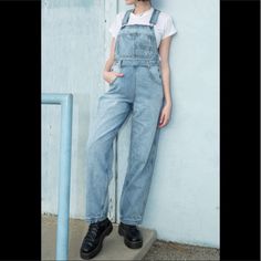 Relaxed Fit Overalls In Light Blue Denim With Two Back And Side Pockets, Three Front Chest Pockets, Belt Loops, Adjustable Straps, And Silver Button Details. Fabrics: 100% Cotton. Measurements: 139 Cm Shortest Length, 147 Cm Longest Length, 76 Cm Inseam, 63 Cm Waist. Made In: China. Brandy Melville Overalls, Light Blue Denim Jumpsuit With Pockets, Trendy Denim Overall Jeans, Light Wash Denim Overalls For Fall, Mid-rise Denim Jumpsuit With Pockets, Trendy High Rise Denim Overalls, Blue Denim Straight Leg Overalls, Medium Wash Mid-rise Denim Jumpsuit, Trendy Blue Denim Overalls