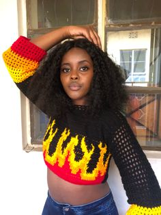 PATTERN NOTES Hello Bobo Stitches fans!, Halloween is upon us and we need to kick it up with this flames crochet top for keeping warm during winter or cold season. The sweater in the pictures is meant for size small or medium. The main colors used are black,orange,yellow,red.  Instructions The pattern used is mainly double crochet stitches. Construction is sideways and in separate panels The turning chain counts as a stitch. Refer to the abbreviations table in case of abbreviations not understoo Crochet Crop Sweater, Pattern Crochet Sweater, Crochet Sweater Pattern, Crop Top Pattern, Pull Crochet, Crochet Crop, Fun Crochet Projects, Classy Dress Outfits, Double Crochet Stitch