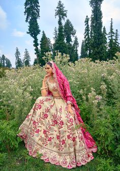 Item: Lehenga Set ( Lehenga Skirt, Blouse and Dupatta) The Ivory  and Rani Pink Jacquard Lehenga Set is a sight to behold, with its intricate embroidery and  jacquard fabric. It's fully customizable, allowing you to create a piece that's uniquely yours. It's the perfect Indian wedding dress for a day wedding or a dazzling reception, making you the most beautiful woman in the room. The Ivory and pink imparts a princess-like aura, with intricate embroidery that creates a timeless and romantic look that is sure to take your breath away. With customization options available, you can personalize this lehenga to make it truly your own, ensuring you look and feel like a princess on your special day. Our bespoke lehengas are designed with a can-can lining beneath the skirt to ensure a voluminous s Pink Choli, Jacquard Lehenga, Lehenga Choli Designs, The Most Beautiful Woman, Rani Pink, Lehenga Fabric, Special Occasion Gowns, Gota Work, Lehenga Skirt