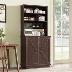 a kitchen cabinet with a microwave and other items on it next to a dining room table