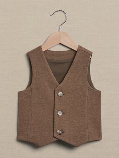 This softly structured vest is cut from a cozy flannel-like fabric with a v-neck and three-button front.  V-neck with button front.  Fully lined.  Standard fit.  To find the best fit, consult the size chart below: Tweed Vest, Cozy Flannel, Baby Shop, Aesthetic Clothes, Baby Toddler, Banana Republic, Size Chart, V Neck, Fabric