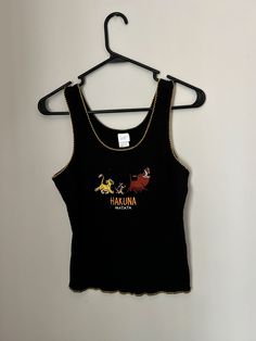 Vintage 1990's Lion King Hakuna Matata knit tank. Size L but would best fit M. Fitted 90s Crew Neck Tank Top, Retro Fitted Crew Neck Tank Top, Fitted Retro Crew Neck Tank Top, Fitted Sleeveless 90s Tops, Vintage Fitted Tank Top, Vintage Fitted Tank Vest, Fitted Vintage Tank Top, 90s Fitted Vest Top, Fitted 90s Style Vest Top