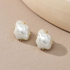 Beautiful Quality Costume Jewelry. Irregular Shaped Large Pearl Stud Earrings. Gold Colored Setting And Back Plate. Brand New. 0.6 X 0.8 Inches. Trendy White Drop Pearl Earrings, Chic White Clip-on Earrings Gift, Chic White Clip-on Earrings For Gift, Trendy White Pearl Drop Earrings, White Chic Clip-on Earrings For Gift, Trendy White Drop Clip-on Earrings, Trendy White Pearl Earrings For Formal Occasions, Trendy White Pearl Earrings, Classic White Pearl Metal Earrings