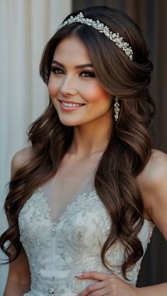 a woman in a wedding dress with long hair and a tiara on her head