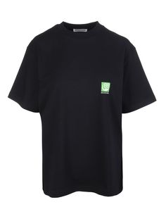 Oversized Balenciaga t-shirt in black cotton with front small green BB Balenciaga logo print and back large green BB Balenciaga logo print. Model with round-neck, wide short sleeve and straight hem. Composition: 100% Cotton Green Balenciaga, Green Logo, Oversized T Shirt, Marie Claire