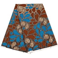 a blue and brown african print fabric with swirls on the front, in various colors