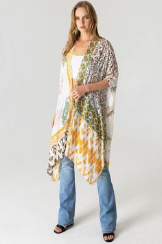 Boho kimono with bold geometric prints.Ultra light, draping open-front. Light and billowy silhouette, perfect for effortless layering. CARE | Hand Wash Cold or Dry Clean CONTENTS | 100% Viscose MEASUREMENTS | 36"/91 cm Top to Bottom (Size O/S) MODEL | 5'8 - wearing O/S IMPORTED Multicolor Printed Wrap Cover-up, Multicolor Flowy Wrap Cover-up, Printed Wrap Kimono For Beach Cover-up, Flowy Open Front Printed Cover-up, White One Size Open Front Cover-up, White Flowy Cover-up With Kimono Sleeves, White Boho Print Kimono For Beach Cover-up, Bohemian Patterned Kimono With Vibrant Print, Casual White Printed Kimono