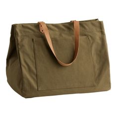 Our exclusive everyday tote bag is made of cotton canvas in a timeless olive-green color. Finished with light-tan leather straps, a front pocket and snap closure, its large, classic silhouette makes it a go-to accessory for weekend trips or beach adventures. Utility Tote Bag, Large Utility Tote, Everyday Tote Bag, Utility Tote, Hot Bags, Cost Plus World Market, Everyday Tote, Olive Green Color, Market Bag