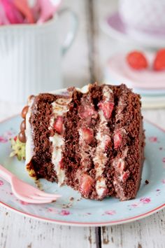 a piece of chocolate cake with strawberries on it