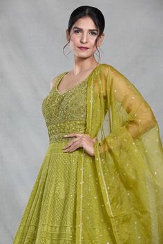 Green sleeveless full length gown with Mughal bloom embroidery using thread, sequin, beads and cutdana highlights. Paired with a ditsy sequin floret work dupatta. - Aza Fashions Sleeveless Wedding Dress For Eid, Sleeveless Georgette Dress For Eid, Sleeveless Green Wedding Gown, Designer Maxi Gown With Sequins, Designer Sequined Maxi Gown, Designer Sequined Maxi Length Gown, Designer Maxi Length Sequined Gown, Elegant Semi-stitched Sleeveless Dress, Traditional Sleeveless Wedding Dress