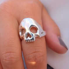 A cool unisex skull ring made of 925 sterling silver. Each piece is made by hand in my workshop in Hatton Garden, London. Much care and attention goes into creating each ring. If you don't know your UK ring size, please send me a message with your ring size and I will make it. Example Swedish ring size, EU, US, German, France etc. Finish: polished Width: Skull: 19mm, shank: 4mmThickness: 2 - 2.5mm  I spend a lot of time putting care and attention into each piece so you can rest assured you will Sterling Silver Skull Ring Gift, Hand Cast Sterling Silver Skull Ring, Handmade Sterling Silver Skull Ring, Sterling Silver Skull Ring Stamped 925, Skull Shaped 925 Silver Ring Gift, Sterling Silver Skull Print Rings As Gift, 925 Silver Skull Ring Gift, Gift Skull Ring Stamped 925, Sterling Silver Rings With Skull Print For Gift