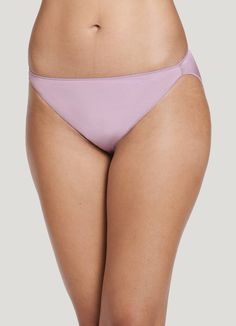 The Jockey® No Panty Line Promise Tactel String Bikini women's underwear provides a flattering look with comfortable coverage under any outfit. Tactel nylon and Lycra spandex offer a smooth, silky feel with plenty of stretch, while our unique leg binding helps eliminate panty lines. Slim sides provide less coverage for worry-free wear. | Jockey® No Panty Line Promise Tactel String Bikini in Soft Mauve Sleek Stretch Swimwear With Smoothing Details, Modern Stretch Smoothing Swimwear, Sleek Stretch Swimwear With Smooth Texture, Modern Stretch Swimwear With Smoothing Details, Modern Stretch Swimwear With Smoothing, Modern Smoothing Stretch Swimwear, Solid Color Sleek Swimwear With Stretch, Sleek Stretch Brief Swimwear, Sleek Stretch Swimwear Brief