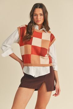 Our "Erin Colorblock Top (Brown Multi)" is a rust colored vest with different shades of orange and brown. It is a super soft material and perfect for back to school! Our model is wearing a size Small. Holiday Glam Outfits, Colorful Vest, Color Checker, Colorblock Top, Night Out Tops, Cute Caps, Perfect Sweater, Sleeveless Knit Top, Glam Outfit