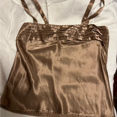 Looks Never Worn. Lovely Bronzy Brown Shade Satin With Horizontal Tucking At Top. Satin Straps Measures Across Flat About 17” Bust And 16” At Waist. Length About 17” Slips Over Your Head. Very Nice Piece. Elegant Tops With Straps In Solid Color, Evening Camisole Tops With Built-in Bra, Evening Cami Top With Straps, Top Satin, Satin Camisole, Brown Shade, 90s Outfit, Brown Shades, Waist Length