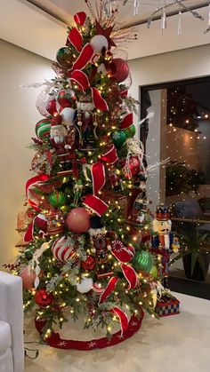 a christmas tree decorated with red, green and white ornaments