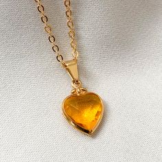 Hypoallergenic Gold Heart Necklace, Gold Hypoallergenic Heart Necklace As Gift, Gold Hypoallergenic Heart Necklace For Gifts, Elegant Yellow Charm Necklaces For Gifts, Elegant Yellow Charm Necklace For Gift, Gold Heart-shaped Hypoallergenic Jewelry, Elegant Amber Jewelry For Valentine's Day, Orange Heart, Heart Necklace