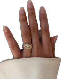 a woman's hand with a ring on it