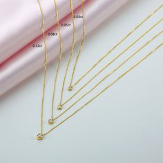 Must-Have A diamond solitaire necklace is a must-have in any jewelry collection! This is the kind of piece you put on and never take off, and it is perfect for necklace layering. ✔ Handmade ✔ Solid Gold ✔ Genuine Diamonds Worldwide DHL shipping now available 1-3 business days NOW USING ITALIAN TRIGGER LOBSTER CLASPS 🛠 All Sarah Elise pieces are handcrafted to order, please allow 4 - 10 business days for shipping out. Need it sooner? Just ask and we will let you know if it's possible. 💎 We use Minimalist Necklace With Tension Setting For Anniversary, Minimalist Diamond White Necklace With Tension Setting, Minimalist Solitaire Necklace With Tension Setting As Gift, Minimalist Gold Necklace With Tension Setting, Minimalist Necklace With Tension Setting For Gift, Minimalist Birthstone Necklace With Diamond Accents For Anniversary, Bezel Necklace Diamond, Solitaire Necklace Diamond, Diamond Drop Necklace