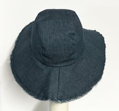 Indulge in luxury with our Wide Brim Denim Hat. Handmade in the USA, this bright blue denim piece exudes sophistication. Its adjustable brim and packable design ensure a perfect fit, while the fringed edge adds a touch of artistry. The cozy padded cotton band provides ultimate comfort. Elevate your style with this exclusive hat. Lined in rayon print 2 section crown 4"brim frayed edges 1" cotton band inside One size fits most up to a 23" Made in the USA Machine wash cold / hand dry Packable press Silk Neck Scarf, Boho Hat, Travel Hat, Wide Brim Sun Hat, Red Chiffon, Denim Hat, Hat Handmade, Scarf Headband, Wide Brimmed Hats