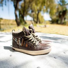 The Inkkas Camping Boot is one of the most unique and comfortable boots -- and this is our first ever in 100% vegan leather. Featuring our classic authentic Peruvian textile, complimented by a beautiful dark brown, these handcrafted and stylish boots will become a welcome companion wherever you travel. 100% vegan leather Soft mesh lining Woven sweater trim around upper, providing added warmth NEW cushion fit technology removable insole Brass eyelets Distressed outsole finish Peruvian Textiles, Woven Sweater, Stylish Boots, Comfortable Boots, Adidas Samba Sneakers, Us Man, Adidas Sneakers, Vegan Leather, Dark Brown