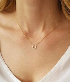 We know you will love the simplicity of our 14k gold filled dainty circle necklace.  This gold piece is as stunning as it is versatile. Wear this piece on its own for your daytime look or layer it with other gold necklaces for a statement-making evening look.  This necklace features a delicate 14k gold filled link chain and a simple open circle pendant design to create a look you will want to wear time and time again. Necklace on model measures 16 inches choose your length from the drop down menu (15" - 18") Circle pendant measures 8mm. Photo #5 - Sterling silver necklace (choose your choice from the drop down menu)  We have the right circle earrings for you to match this beautiful necklace -  https://www.etsy.com/il-en/listing/466244747 This necklace is available also with 14K Gold filled Dainty 14k Gold Filled Circular Jewelry, Delicate Circle Clavicle Chain Necklace, Simple Gold Round Necklace, Simple Gold Necklace With Round Shape, Simple Gold Necklace With Round Pendant, Gold Necklace With Simple Round Design, Simple 14k Gold-filled Necklace, Dainty Open Circle Clavicle Chain Jewelry, Dainty Clavicle Chain With Open Circle Pendant