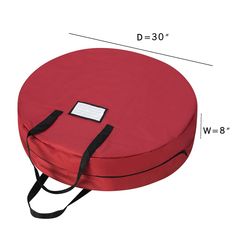 a red round cushion with black straps