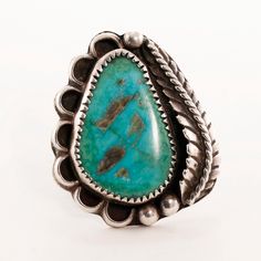 Awaiting your purchase is this Navajo Native American sterling silver ring crafted by Orvile Tsinnie in this wonderful scalloped applied leaf rain drops design featuring green turquoise. This special item remains in Excellent condition. Size / Item Length: 5.75 Width: 33.9 mm Stone Dimensions (MM): 23.7 x 15 mm Weight: 12.78 g ------------------------------- TERMS OF SERVICE: - All of our stones are natural earth mined stones, unless stated otherwise. -We have tested all stones & metals that we Bohemian Oval Stamped Jewelry, Handmade Southwestern Teardrop Turquoise Ring, Bohemian Green Stamped Jewelry, Adjustable Teardrop Vintage Rings, Adjustable Vintage Teardrop Rings, Western Green Turquoise Ring In Sterling Silver, Vintage Concho Ring Jewelry, Vintage Teardrop Patina Jewelry, Collectible Bohemian Teardrop Jewelry