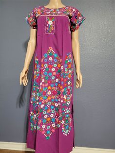 This beautiful floral dress is completely hand embroidered by Mexican artisans, it is ideal for a formal occasion or Bridesmaid in any event, comfortable and beautiful. It has hand embroidered flowers  This dress is handmade by Mexican Artisans in Mexico. Note: Since this dress is Hand embroidered the embroidered colors on each dress vary, making them one of a kind. We recommend washing by hand with cold water, tender in the shade, to better preserve the original color Traditional Purple Floral Print Dress, Traditional Floral Print Maxi Dress With Short Sleeves, Traditional Short Sleeve Maxi Dress With Floral Print, Traditional Short Sleeve Floral Maxi Dress, Traditional Floral Embroidery Maxi Dress For Fiesta, Traditional Floral Embroidered Maxi Dress For Fiesta, Traditional Maxi Dress With Floral Embroidery For Fiesta, Fiesta Floral Embroidered Maxi Dress, Embroidered Purple Maxi Dress