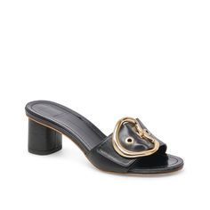 Dolce Vita-Laika Sandal Get captivated by the mid-century elegance of the Dolce Vita Laika sandal. The slip-on sandal features an oversized buckle accent that reflects retro style, while the chic block heel offers elevated support. Luxury Spring Mules With Buckle Closure, Luxury Mules With Buckle Closure For Spring, Modern Closed Toe Heels With Buckle Closure, Chic Open Toe Mules With Tang Buckle, Chic Summer Mules With Tang Buckle, Designer Mules With Buckle Closure For Spring, Chic High Heel Block Heels With Buckle Closure, Chic High Block Heels With Buckle Closure, Chic Open Heel Sandals With Buckle Closure