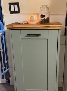 a small kitchen island with a wooden top