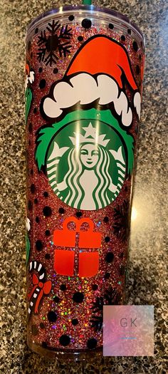 the starbucks holiday cup is decorated with glitter