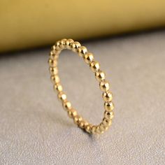 "Gold Beaded Band Ring, Dainty Stacking Ring, Real Gold Ball Ring, Minimalist Dotted Ring, Eternity Bead Band Ring, Gold Ring for Women  ❥ Customers satisfaction is our biggest priority, please contact us with any questions/queries for future or existing orders, and we will do our best to make sure you are happy with your order. ❥Please make sure to add the correct address during check out. You can return your purchased item within 15 days after successful delivery. We offer a 100% \"Money Back Guarantee\" if you are not satisfied with your purchase. Return charges will be paid by buyers only! ❥ Please share your numbers (in personalization box ) as required for shipping address details, and it'll help us to contact you easily. And don't worry about the privacy, we'll keep it safe with us, Kugel Ring, Beaded Stacking Rings, Dot Ring, Beaded Ring, Brass Band, Ringe Gold, Ring Stacking, Gold Ring Stack, Midi Rings