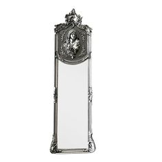 an ornate silver mirror with a lion head on it's face and border around the edges