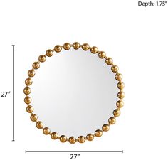 a round mirror with gold balls on the bottom and an area for measurements to be displayed