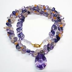 "DESCRIPTION: Thank you for coming in! A breath-takingly beautiful necklace made of an assortment of natural gemstones! You can find Iolite, Amethyst, sunstone and peach moonstone in this one necklace! Premium quality gemstones finished with gold filled headpins and 18k solid yellow gold clasp! 17\" gorgeous necklace, 186.9 carats! You'll get the necklace you see! SIZE: 14.7mmx23.5mm center stone. GRADE: Transparent COLOR: Multi" Luxury Purple Necklace With Gemstone Beads, Luxury Amethyst Necklaces With Natural Stones, Luxury Amethyst Gemstones With Natural Stones, Luxury Amethyst Necklace With Natural Stones, Luxury Natural Amethyst Gemstones, Luxury Amethyst Multi-stone Necklace, Luxury Multi-stone Amethyst Necklace, Amethyst Multi-stone Briolette Gemstones, Amethyst Briolette Necklace For Jewelry Making