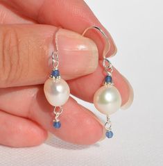 Genuine Freshwater Pearl Earrings with Sapphire 'Jade' gemstone accent - Authentic White Pearl Jewelry - Handmade Earrings - Pearl is June's Birthstone and Sapphire is the September Birthstone - Elegant & Everyday Earrings - Silver-plated ear wire and spacer beads - Multiple styles: (1)  8mm round white Freshwater Pearls with 2mm Sapphire 'Jade' gemstone accents & dangles - Overall earring length is 1.45 inches (3) (2)  8mm round ivory Freshwater Pearls with 2mm Sapphire 'Jade' gemstone accents White Pearl Earrings In Sterling Silver, Adjustable Nickel-free White Crystal Earrings, Sterling Silver Jewelry With Round Birthstone Beads, White Gemstone Dangle Crystal Earrings, White Crystal Pearl Drop Earrings As Gift, White Crystal Gemstone Drop Earrings, White Gemstone Crystal Dangle Earrings, Pearl White Hypoallergenic Round Beads Jewelry, Sterling Silver Crystal Earrings With Pearl Drop For Gift