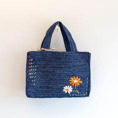 IN STOCK FAST SHIPPING FROM LOS ANGELES Get ready to tote your summer essentials in style with this handmade straw bag! Made from natural raffia, this bag features a charming daisy flower design and a large opening for easy access. The top handles make it a breeze to carry, perfect for a day at the beach or a picnic in the park. It's the ultimate combination of fashion and functionality. (Plus, it's totally handmade, so you know it's special.) Size: 9"H x 13"W x 4"D Designer Style ID: 8629 Spring Handheld Straw Beach Bag, Spring Beach Bag With Braided Handles, Spring Handheld Beach Bag With Braided Handles, Chic Handheld Straw Bag For Spring, Spring Travel Handheld Straw Bag, Spring Handheld Straw Bag With Braided Handles, Bohemian Rectangular Bag For Spring, Trendy Handwoven Shoulder Bag For Spring, Spring Straw Bags For Daily Use